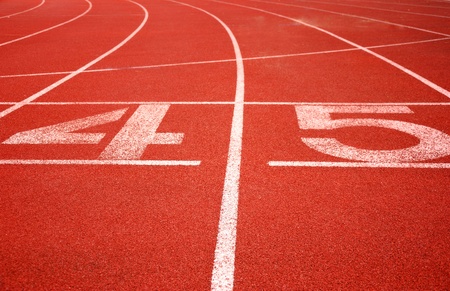Athletic man on track starting to runの写真素材