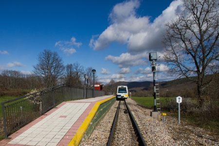 Narrow Gauge Train stopped at station or stopping place on the field 