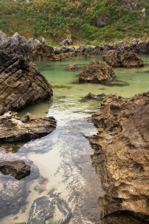 Transparent water and rocks on the beach Barro  Asturias の写真素材