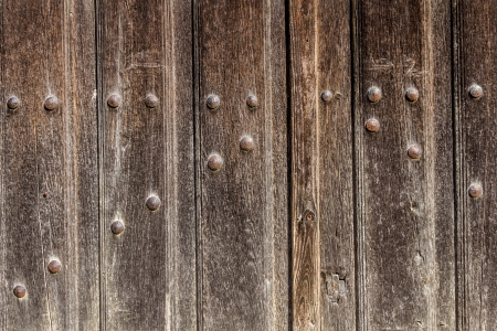 Old wooden gate with iron nails old for background or texture の写真素材