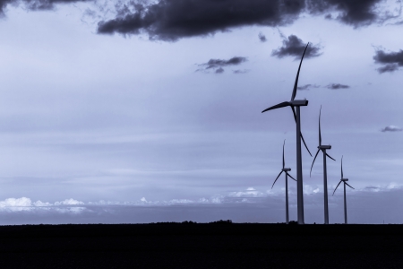 Wind Turbines with dark clouds backgroundの写真素材