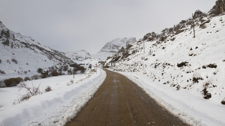 Mountain road in snow の写真素材