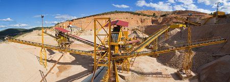 Panoramic view of gravel with ribbons distribution according to sizes in the gravel quarry outdoors の写真素材