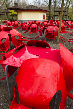 Terrace of empty public park kiosk on a rainy day and the tables and chairs set outの写真素材