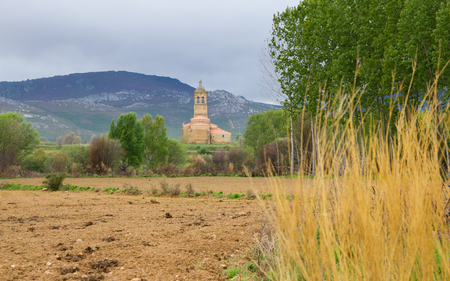 Overview of the outside of the Church of Christ in Tabuyo del Monte, Between fields and mountains. Built in stone from the XVIII century. Province of Leon. Spainの写真素材