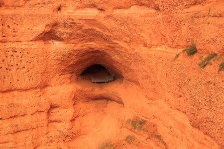 Detail of a cave mouth in Las Medulas from the Orellan viewpoint with tourists. Ancient Roman gold...