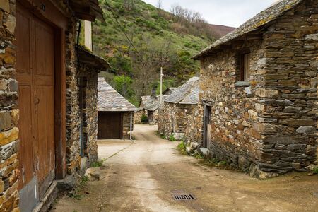 Traditional stone houses with slate roofs in mountain landscape. Province of Leon in Spainの写真素材