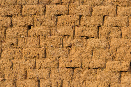 Wall for background or texture. Blocks of adobe, mud and straw cooked in the sunの写真素材