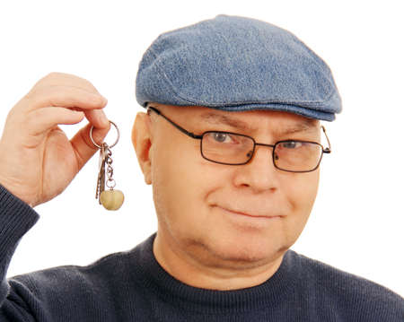 adult man holding a few keys, isolated on white background の写真素材