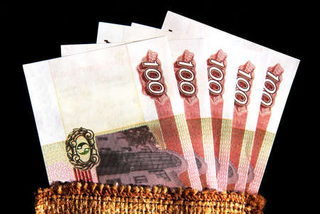 five banknotes in denominations of one hundred units on a dark blue background 