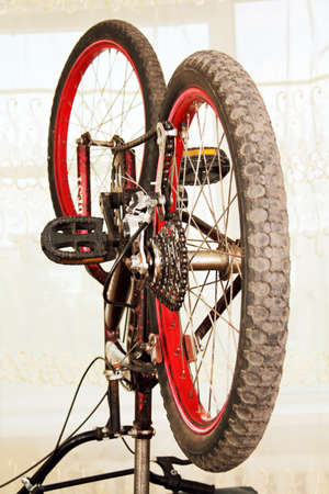 inverted bicycle, ready to repair, close-up rear wheel 