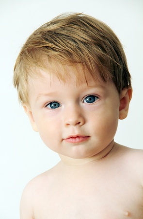 portrait of a little boy close-up photo on light background.の写真素材
