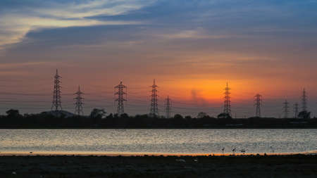 Lake water with Sunset middle of communication cell phones towers