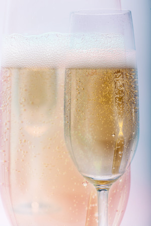 golden champagne fizz up in wineglassの写真素材