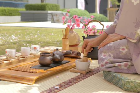 japanese woman stiring the green teaの写真素材