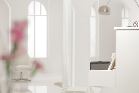 a white piano put in the white lobby loungeの写真素材