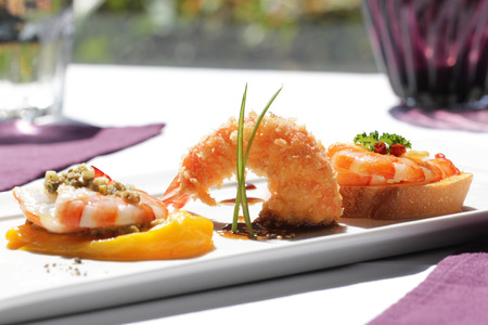 fried shrimp, spicy shrimp with baguette and shrimp with roasted peachの写真素材
