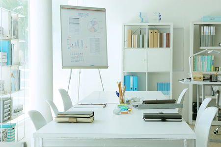meeting room is ready with some graphs on white boardの写真素材