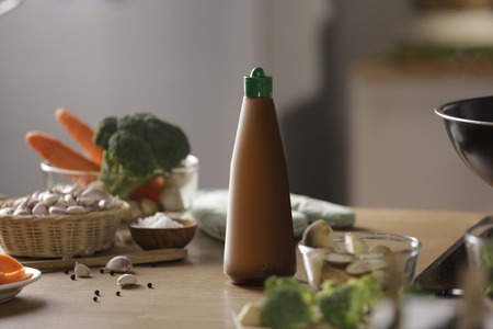 a sauce bottle put on counter in a kitchenの写真素材
