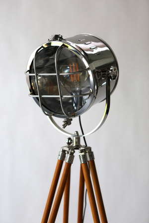 a studio lamp in retro style with wooden tripodの写真素材