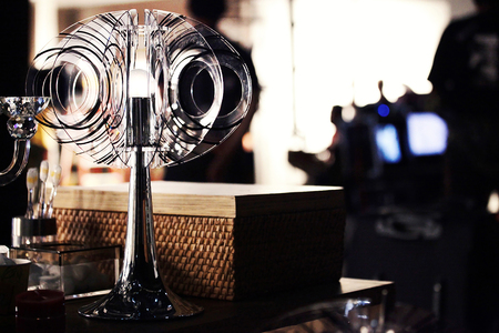 a modern design electric lamp made from oval acrylic sheets for the hood put on a table in living roomの写真素材