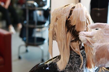 light color wet hair are whole head applying in salonの写真素材