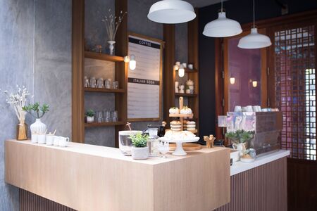 a corner of coffee counter bar is setup in front of empty shop for shooting a movieの写真素材