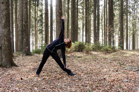 Active lifestyle - healthy lifestyle. Relaxing in the nature. Outdoor activities and meditating in wood. Unspoiled and healthy forest.の写真素材