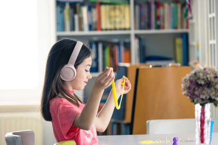 Creative games improving children imagination. Young girl have fun with creative and mind games.の写真素材