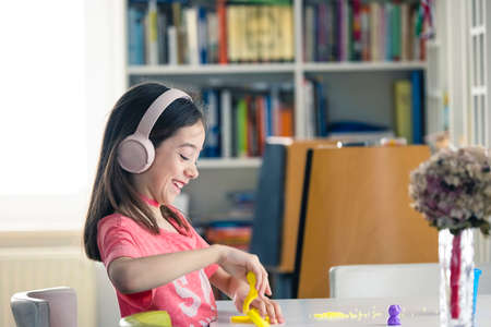 Creativity at young  age improving cognitive abilities. Lovely girl have fun with creative and mind games.の写真素材