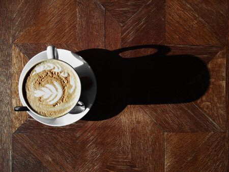 Coffee cup on wooden table