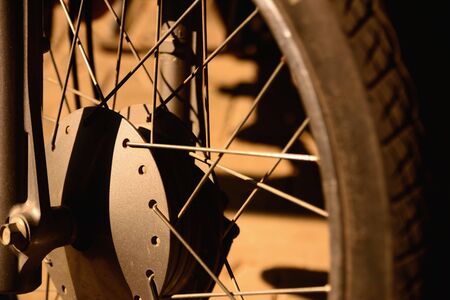 Engineered motorcycle wheel parts. Mechanical engineering design and technology image, dark tone and...