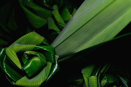 Bouquet of roses flowers handmade from folded fragrant pandan leaves, isolated on black backgroundの写真素材