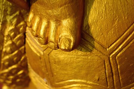 Close Up detail of golden turtle statue in the temple, northern Thailand.の写真素材