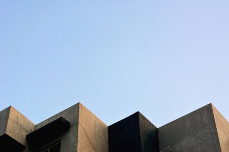 Abstract architecture of a modern building with blue skyの写真素材