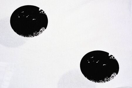 Black and white screen shot of global on a white piece of cloth.