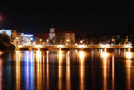 Night view of the river bridge, natural landscape background in Chiang Mai, Thailand.の写真素材