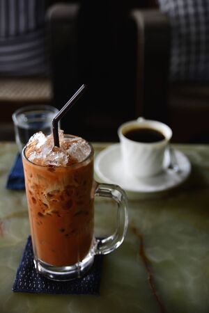 Ice tea and black coffee with natural background, a simple idea photography.の写真素材