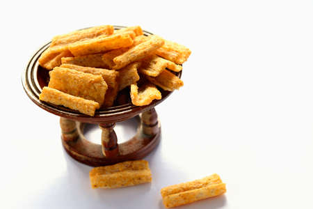 Baked multigrain snack barbeque flavor isolated on white background.