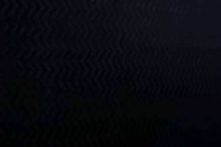 Perspective view of dark glass film texture background.
