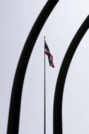 Thai flag through the fence shadow on white sky backgroundの写真素材