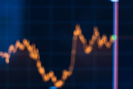 Abstract blurred stock market chart on dark background