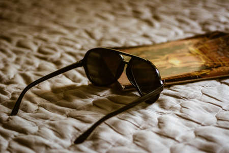 Closeup black sunglasses on white background.の写真素材