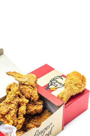 Chiang Mai, Thailand - January 10, 2021: KFC fried chicken fast food with delivery packaging isolated on white background.のeditorial素材