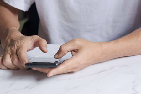 Man using smartphone search for business information. Business concept.