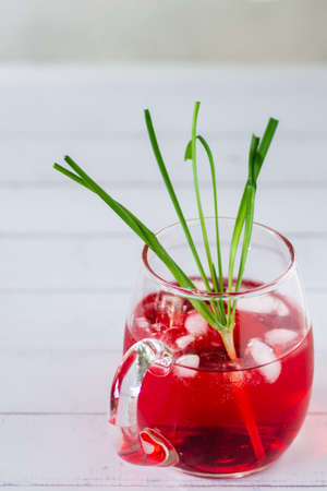 Iced soda red water on natural light background.
