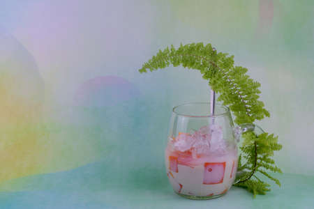 Cold papaya smootie on natural color background. Fresh drink.の写真素材