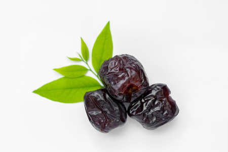 Candied jujube, sweet chinese red date fruit isolated on white background.