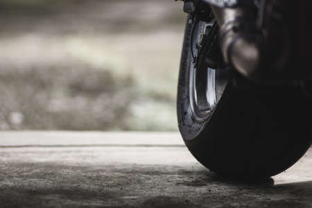 Closeup motor bike on the road with nature light background.