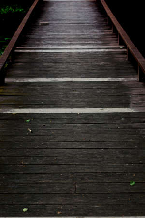 Wooden bridge on natural light background.の写真素材
